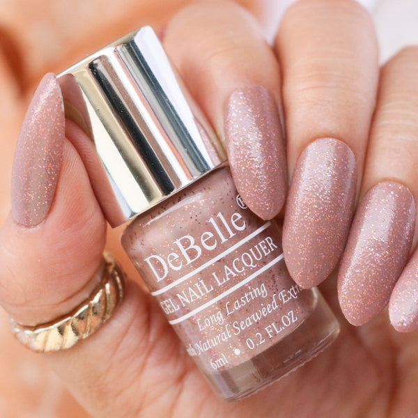Change the look of your nails with DeBelle gel nail  color Angelic Saira the mauve with copper shimmer. Shop online at DeBelle Cosmetix online store.