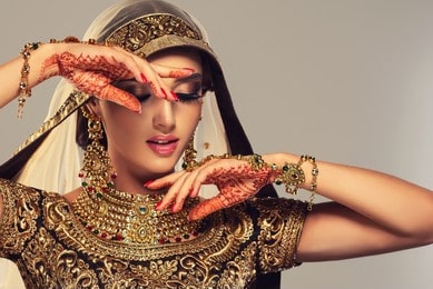 Beautiful Indian bride in profile with long and shiny wavy hair . Beauty face with the bridal look on her face