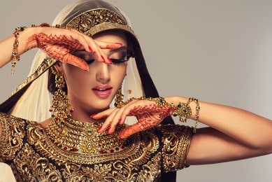 Beautiful Indian bride in profile with long and shiny wavy hair . Beauty face with the bridal look on her face