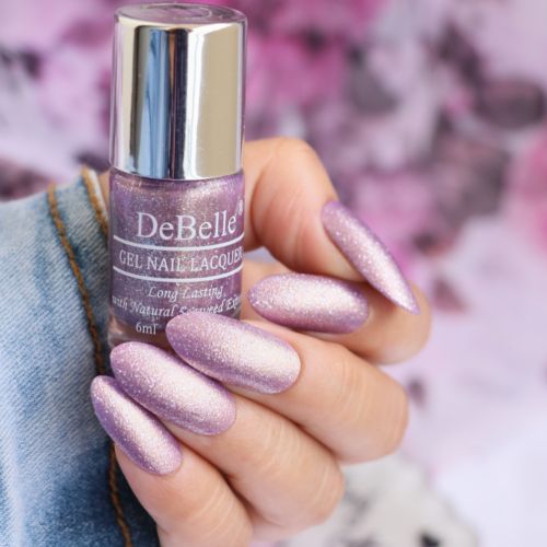 An elegant siver shiimer with DeBelle gel nail color AppealingAura. Buy this purple with silver shimmer  shade online at DeBelle Cosmetix online store.