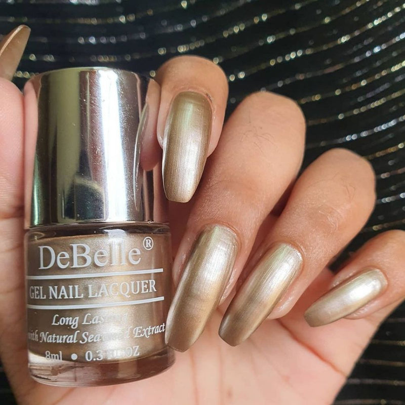 Proud looking nails with DeBelle gel nail color nChrome Beioge the beige with a metallic sheen. Buy this cruelty free shade online at DeBelle Cosmetix online store.