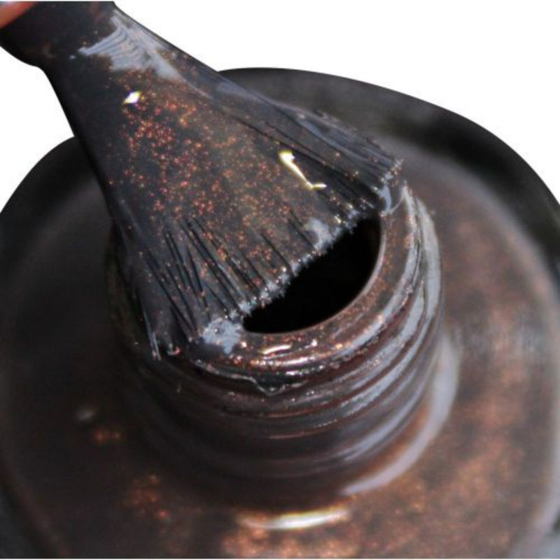 An exclusive shade of DeBelle-DeBelle gel nail color Copper Glaze , the grey with copper specks. Available at DeBelle Cosmetix online store.