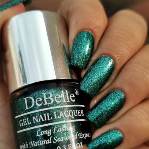 Glittery nails with DeBelle gel nail color Cosmic Emerald. Shop online for  this vegan cruelty free non toxic shade at DeBelle Cosmetix online store. 