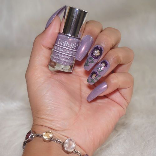 Imagination soars high with DeBelle gel nail color Dainty Diana the purple with a shimmer. Shop for this shade enriched with hydrating seaweed extract at DeBelle  Cosmetix online store.  i