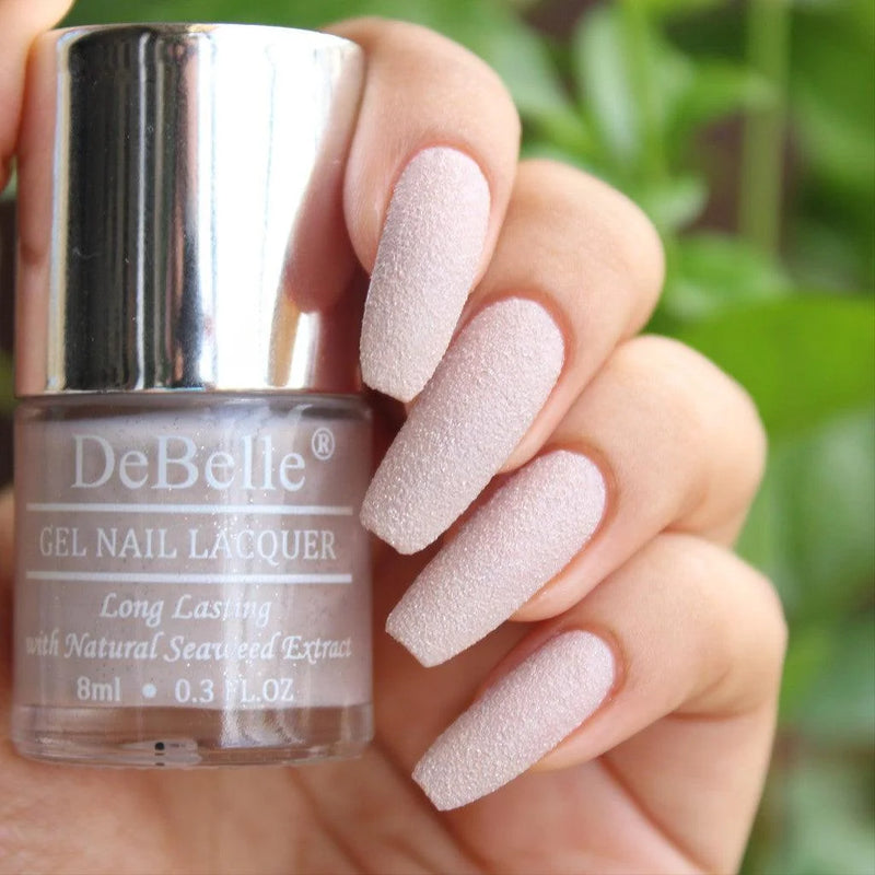 This  dusty pink with gliiter  at your nail tips will make many a heart skip a beat.  This alluring quick drying , chip resistant .vegan , cruelty free nail color is available at DeBelle Cosmetix online store.