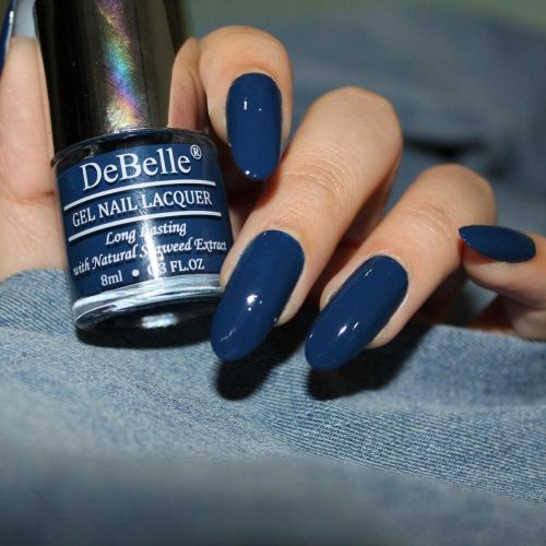 Smiling nails with DeBelle gel nail color the navy blue shade . Shop online with COD facility at DeBelle Cosmetix online store.