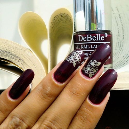 Nail art created with DeBelle gel nail color Glamorous garnet. Shop online at Debelle cosmetix online store with COD facility.