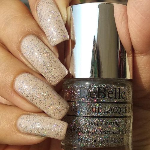 Shimmery nails with DeBelle gel nail color Shimmer Top Coat.Shop online at DeBelle Cosmetix. onlinme store for this shade enriched with hydrating seaweed extract.
