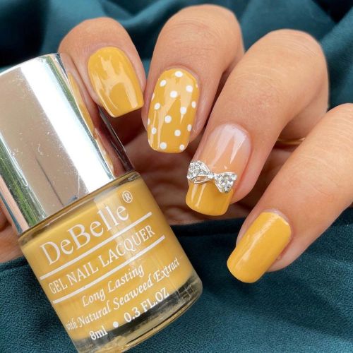 Enchanting nail art with DeBelle gel nail color Yellow Topaz. Shop online for this shade enriched with  hydrating seaweed extract.