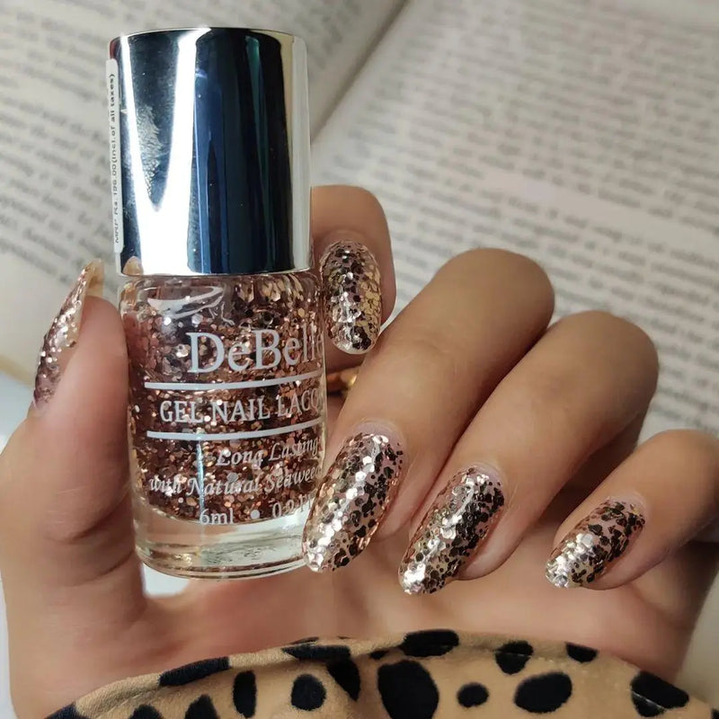 For that exclusiv e glitter for your nails -DeBelle gel nail  color Elite Tiffany the rose gold glittery top coat.Buy this vegan , cruelty free, non toxic , chip resistant , quick drying nail color at DeBelle  Cosmetix online store.