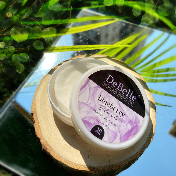 DeBelle Blueberry Blush Nail Lacquer Remover Wipes-close-up view placed on a shiny surface
