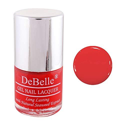 DeBelle Scarlet Red Nail Polish Front view of nail polish bottle with a white background and a coloured droplet 