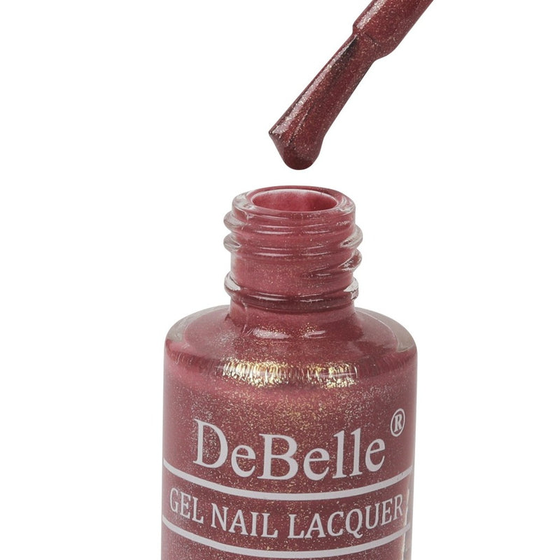 Opened bottle of Debelle Mauve with micro shimmer with the Nail Brush has White background