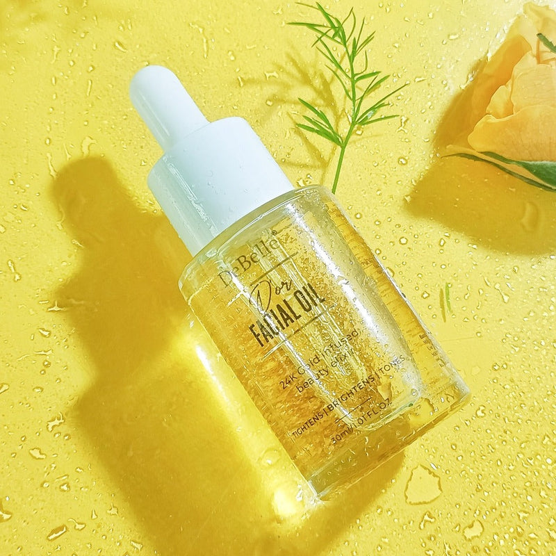 Debelle Golden Facial oil filled with oil placed against a yellow background and a yellow rose next to it.