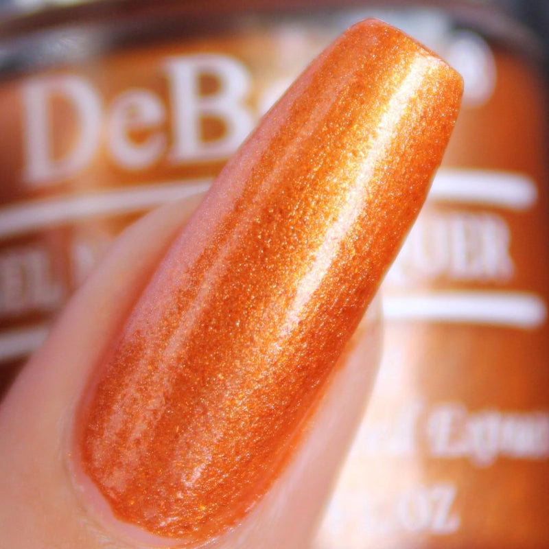 Make heads turn with DeBelle gel nail color Aurora  the amber with copper orange glitter shade. Shop online at DeBelle Cosmetix online store.