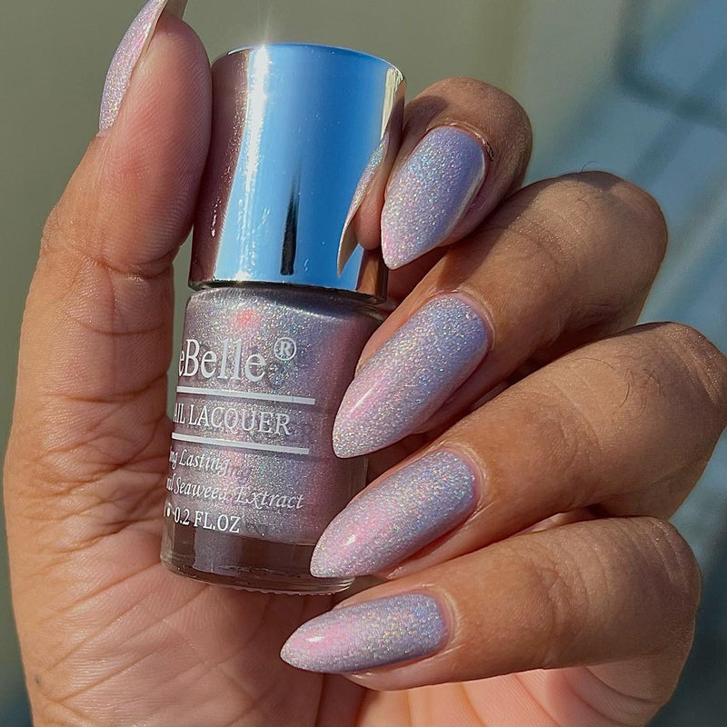 Elegance at your nail tips with DeBelle gel nail color Awesome Andrea the delightful purple shade with.the silver glitter. Shop online at DeBelle Cosmetix online store  with COD facility.