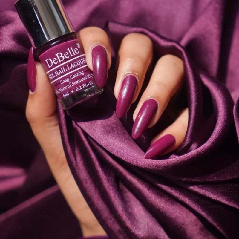 Dazzle at the party  with the bewitching dark magenta DeBelle gel nail color Carolyn Charisma at your nail tips. Buy this shade enriched with hydrating and nourishing seaweed extract at DeBelle Cosmetix online store.