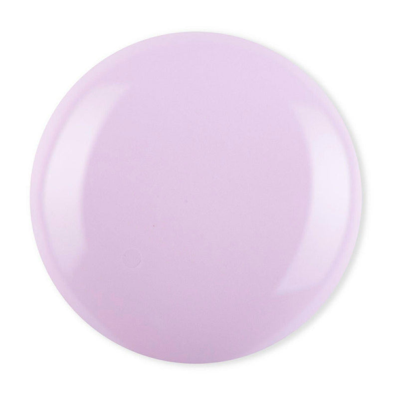 Droplet of Debelle Soft lilac Nail polish with a white background.