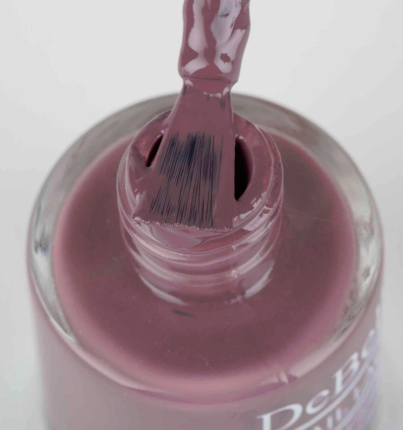 DeBelle Vintage Mauve Nail Polish - Close-up view of the nail polish brush with the bottle 