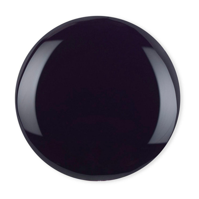 Droplet of Debelle Dark Violet Nail polish against a white bacground.