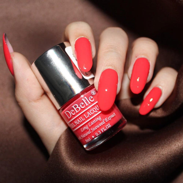 The bright red on your nails -DeBelle gel nail color French Affair. Available at DeBelle Cosmetix online store at affordable price.