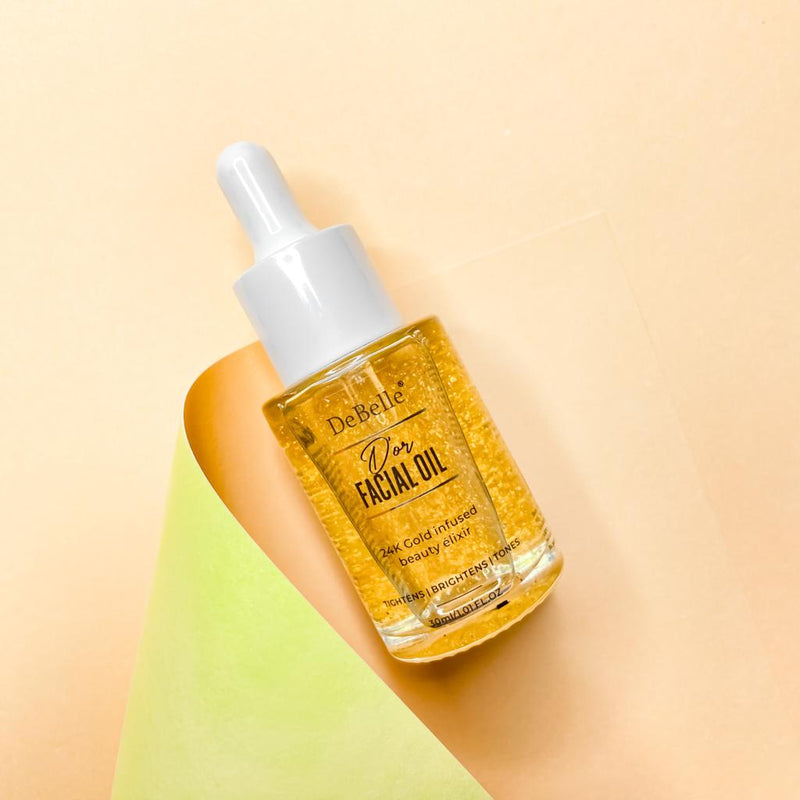 Debelle Golden Facial oil filled with oil placed against a cream background 