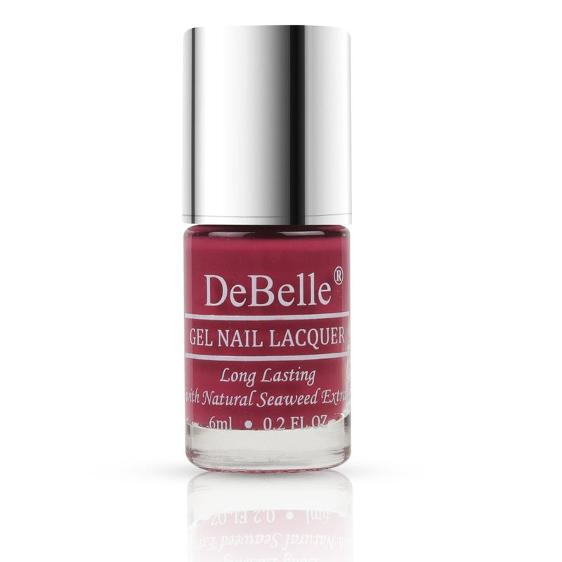 bottle of Debelle Magenta Pink Nail Polish bottle with a white background 