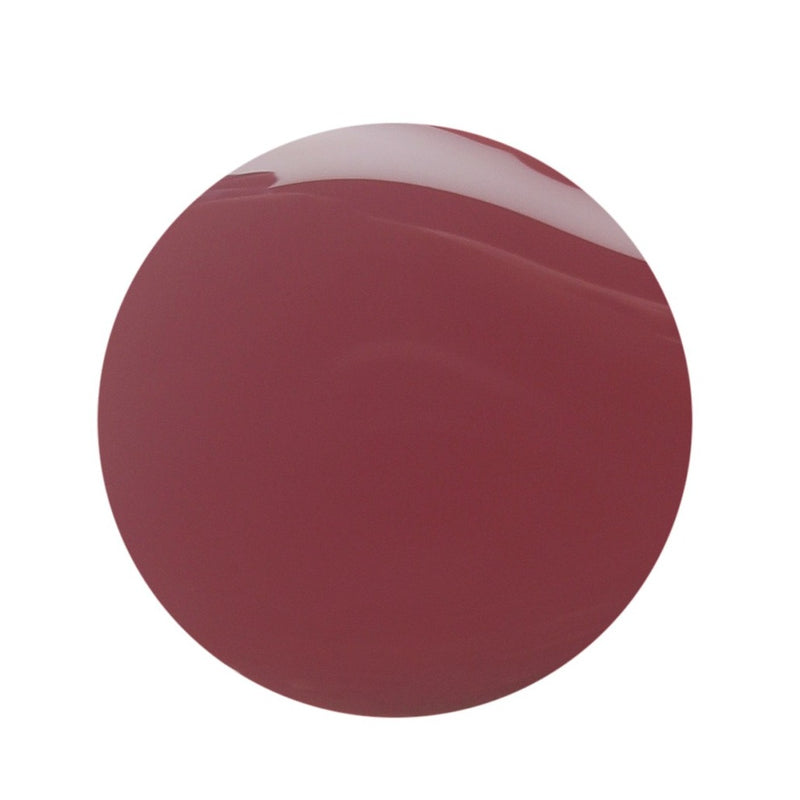 Droplet of Magenta Pink Nail polish from Debelle has white background 