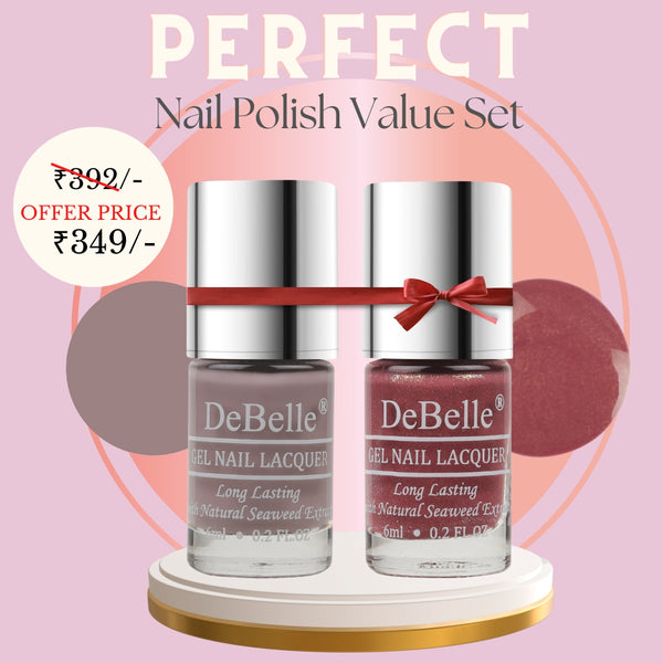 Debelle two nail polish bottle Rhapsody and Classy Chole against a pink background.
