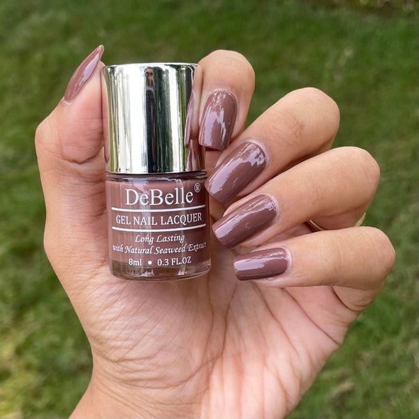 beautifully manicured nails with debelle dark rust brown nail polish with a beautifully manicured nails 