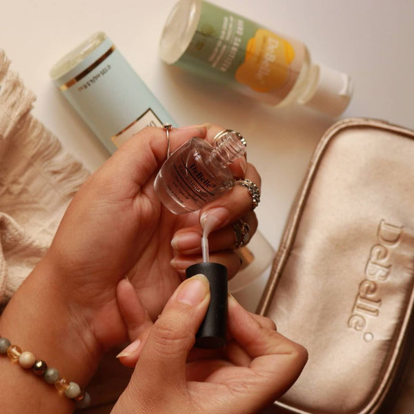 Using Debelle Nail hardner with a Debelle Pouch and a Shower gel in the background. 
