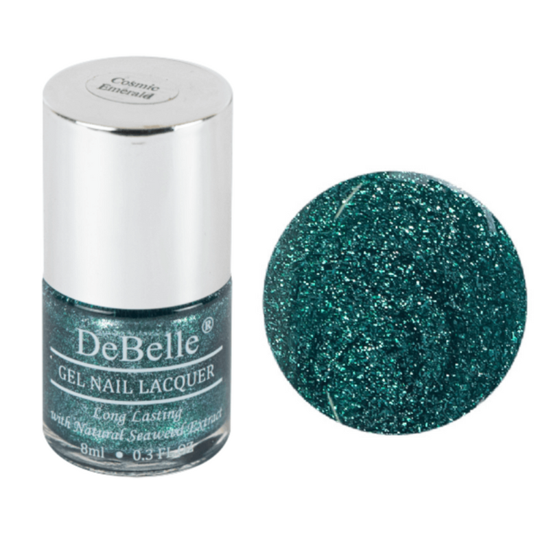 DeBelle Emerald green Nail polish bottle against a white background and droplet of the same shade.