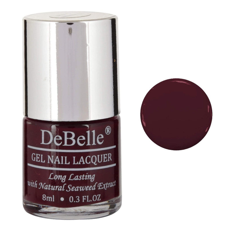 DeBelle Deep Maroon Nail Polish Front view of  nail polish bottle with a white background and a shade droplet
