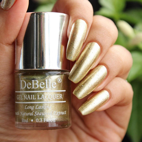 Give  your nails a dazzling  look with  this awesome beauty  Canopus. Buy this  DeBelle beige gold with black glitter shade at  DeBelle Cosmetix online store at affordable price.
