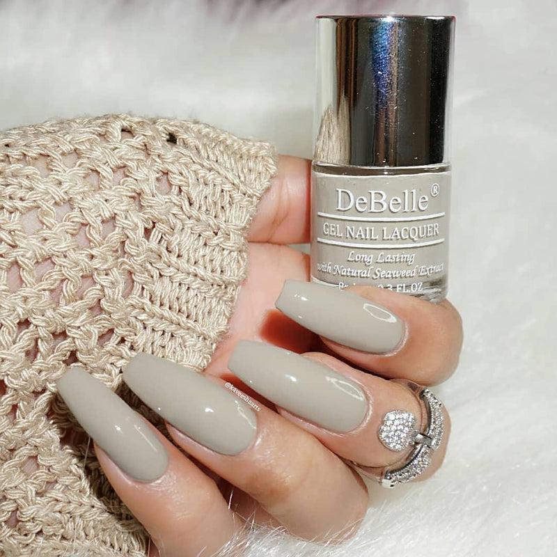 Painted nails a part of  your elegant look for the new year party. Look different with nails painted in this shade of Debelle Moon Stone.This dark grey with brown cnail color is available at Debelle Cosmetix Online Store.