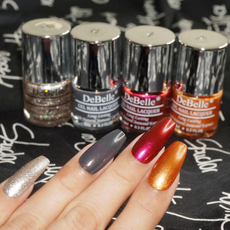 Collection of Four Nail Polish which are Sparkling,Dust Aurora ,Antares & Copper Glaze from DeBelle with the painted Nails.