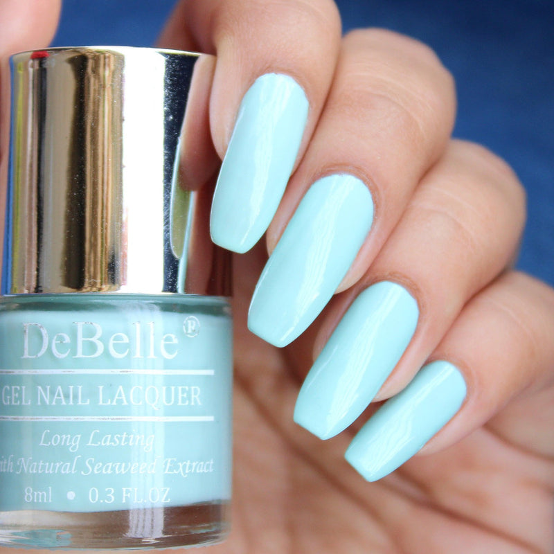 DeBelle's mint_blue Nail Polish Bottle with the painted nails