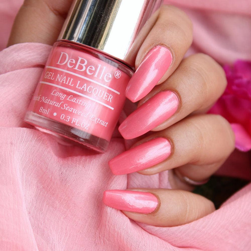 DeBelle's miss_bliss Nail Polish Bottle with the painted nails has pink background