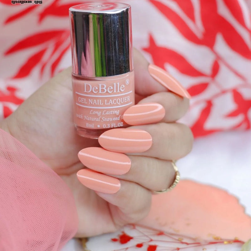 Elegant nails with  DeBelle  gel nail color Dear Dahlia the beautiful blend of orange with peach. Get this shade and many more at DeBelle Cosmetix online store.